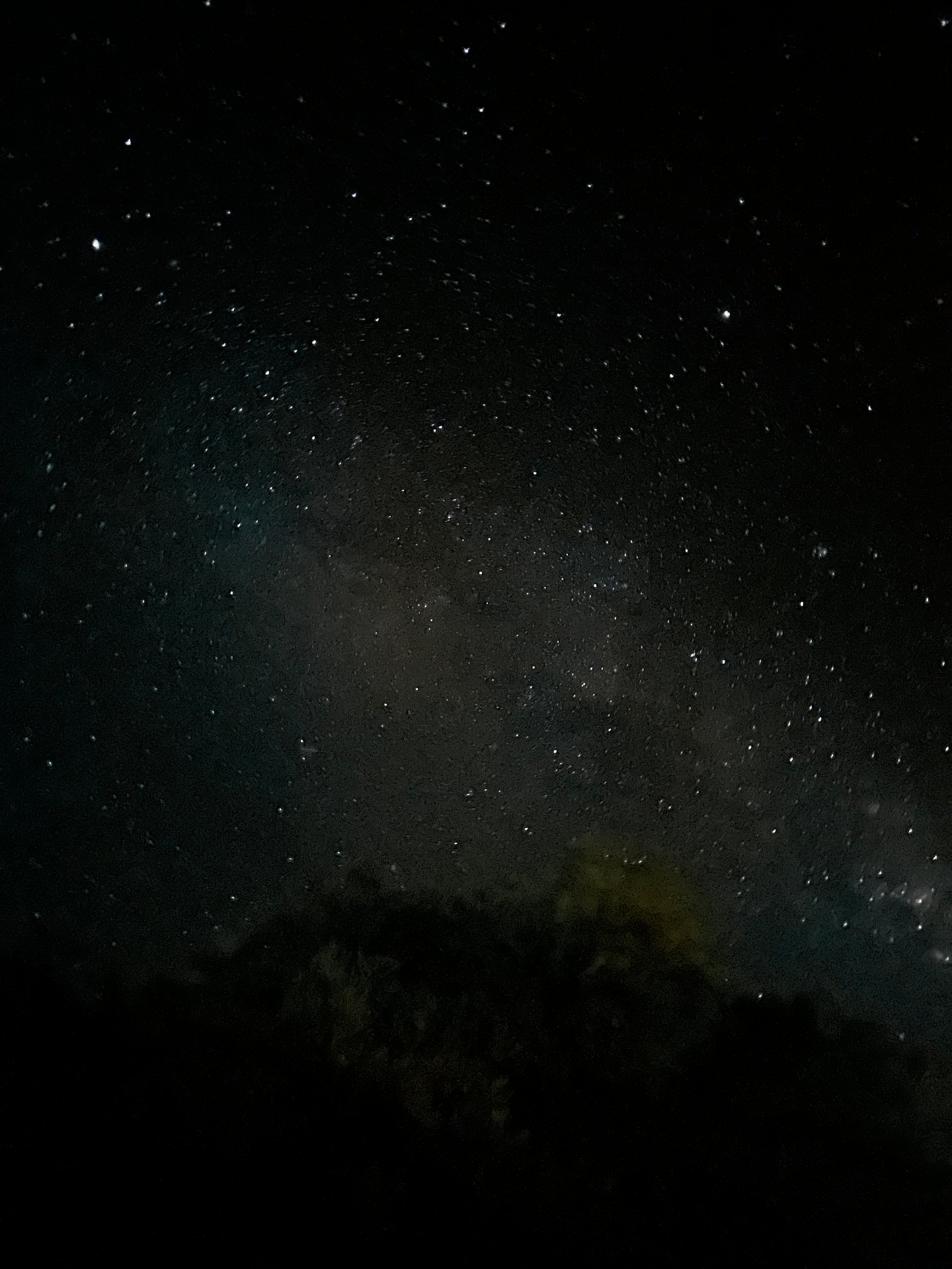 A dense field of stars filling the frame, the faint dust of the Milky Way diffuse across the centre.